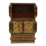 A Chinese sectional lacquer cabinet,