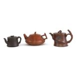 A collection of three Chinese Yixing zisha teapots,