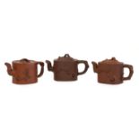 A collection of three Chinese Yixing zisha teapots,