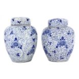 A pair of Japanese blue and white jars and covers,
