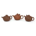 A collection of three Yixing zisha teapots,