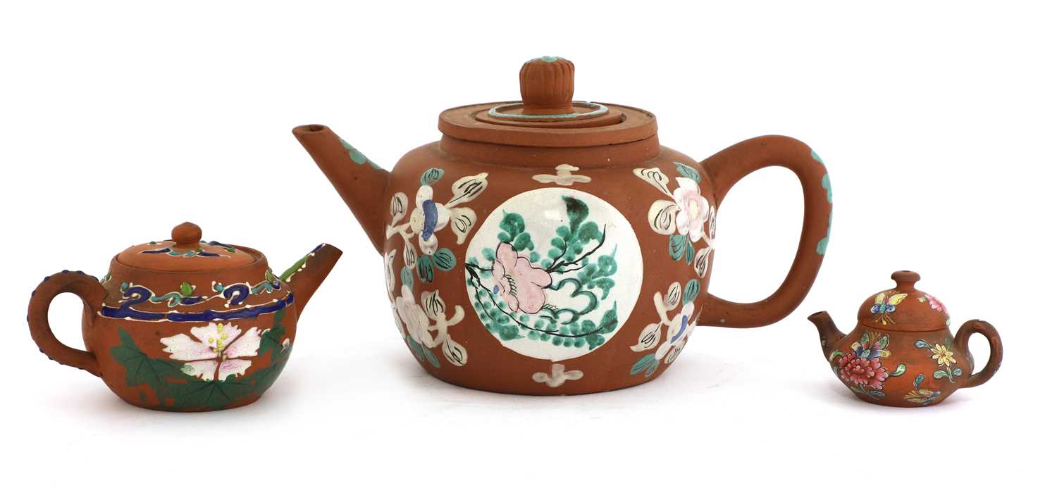 A collection of three Chinese Yixing zisha teapots,