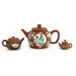 A collection of three Chinese Yixing zisha teapots,