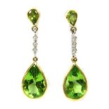 A pair of 18ct yellow and white gold peridot and diamond drop earrings,