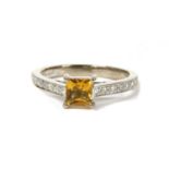 An 18ct white gold citrine and diamond ring