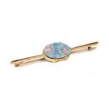 A gold opal doublet bar brooch