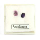 Two unmounted oval mixed cut purple sapphires