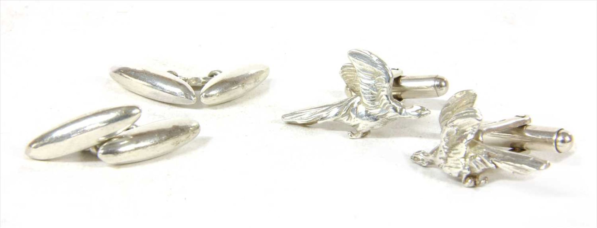 A pair of sterling silver pheasant in flight cufflinks,