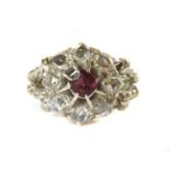 An Edwardian garnet and diamond circular cluster