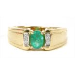 An 18ct gold emerald and diamond ring,