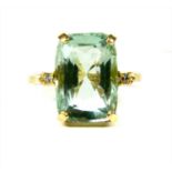 A gold three stone aquamarine and diamond ring,