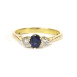 An 18ct gold sapphire and diamond three stone ring