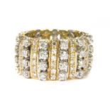 A two colour gold diamond set band ring,