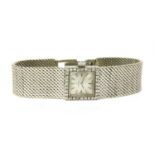 A ladies' 18ct white gold diamond set Omega mechanical bracelet watch, c.1960