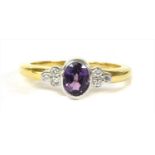 An 18ct gold purple sapphire and diamond ring,