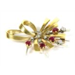 A gold ruby and diamond spray brooch