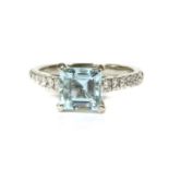 A platinum aquamarine and diamond ring