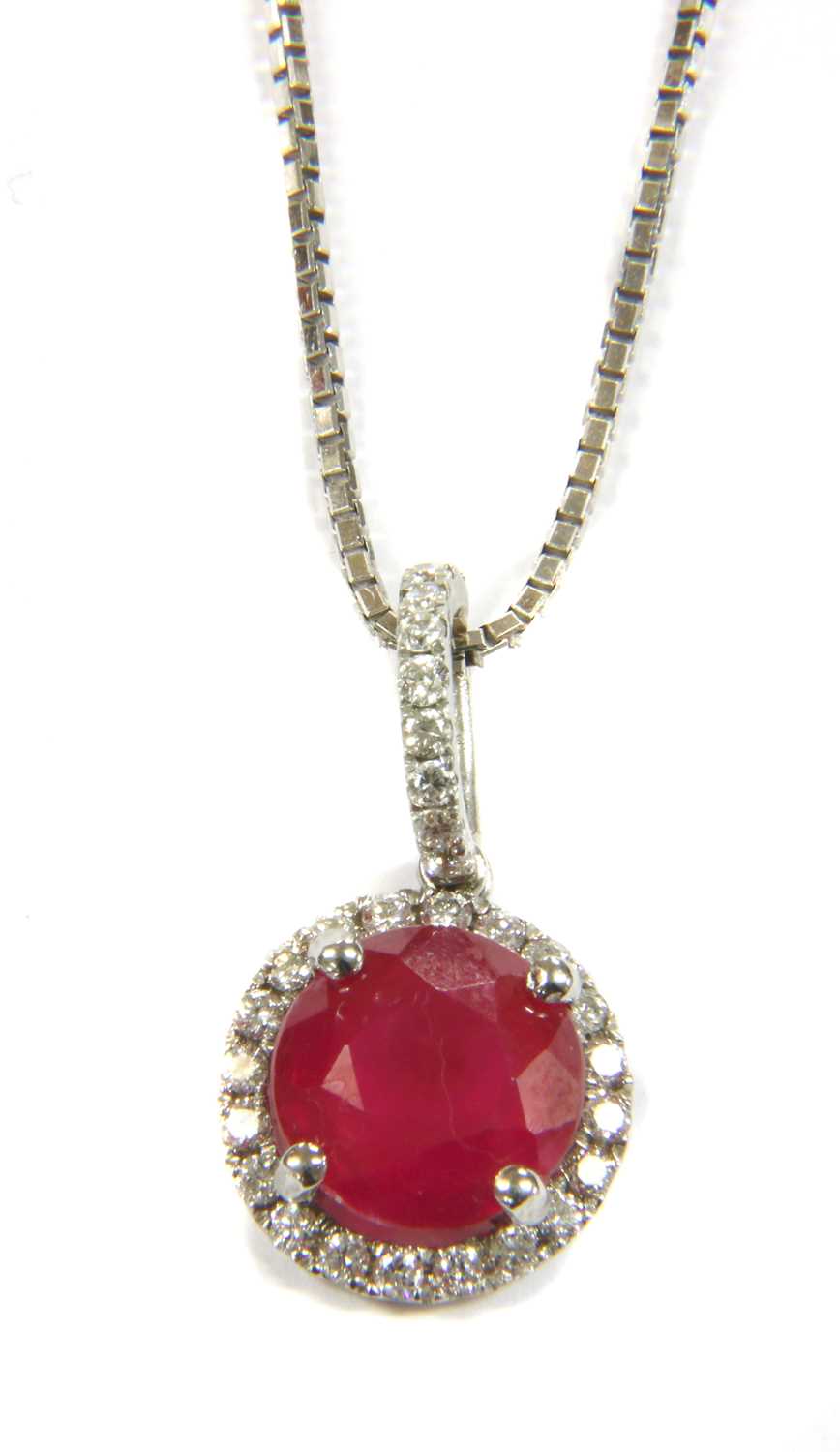 An 18ct white gold ruby and diamond cluster pendant