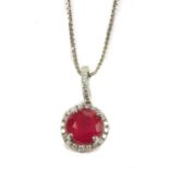 An 18ct white gold ruby and diamond cluster pendant