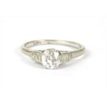 A platinum three stone diamond ring,