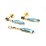 A gold blue topaz and sapphire earrings and pendant suite,