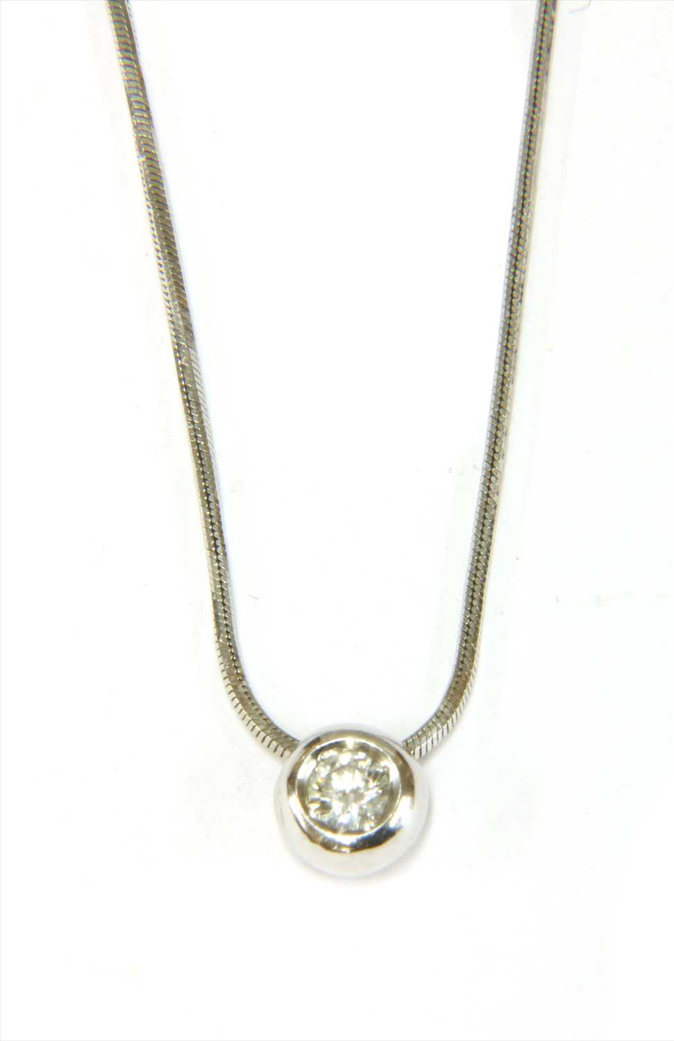 An Italian white gold single stone diamond slide pendant,