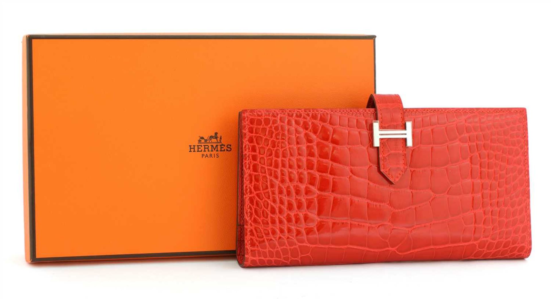 An Hermès red alligator skin wallet