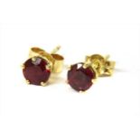 A pair of 18ct gold ruby stud earrings,