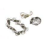 An Arts & Crafts silver bracelet and brooches