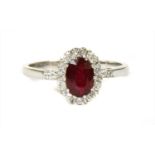 An 18ct gold ruby and diamond cluster ring,
