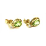 A pair of 18ct gold peridot and diamond earrings,