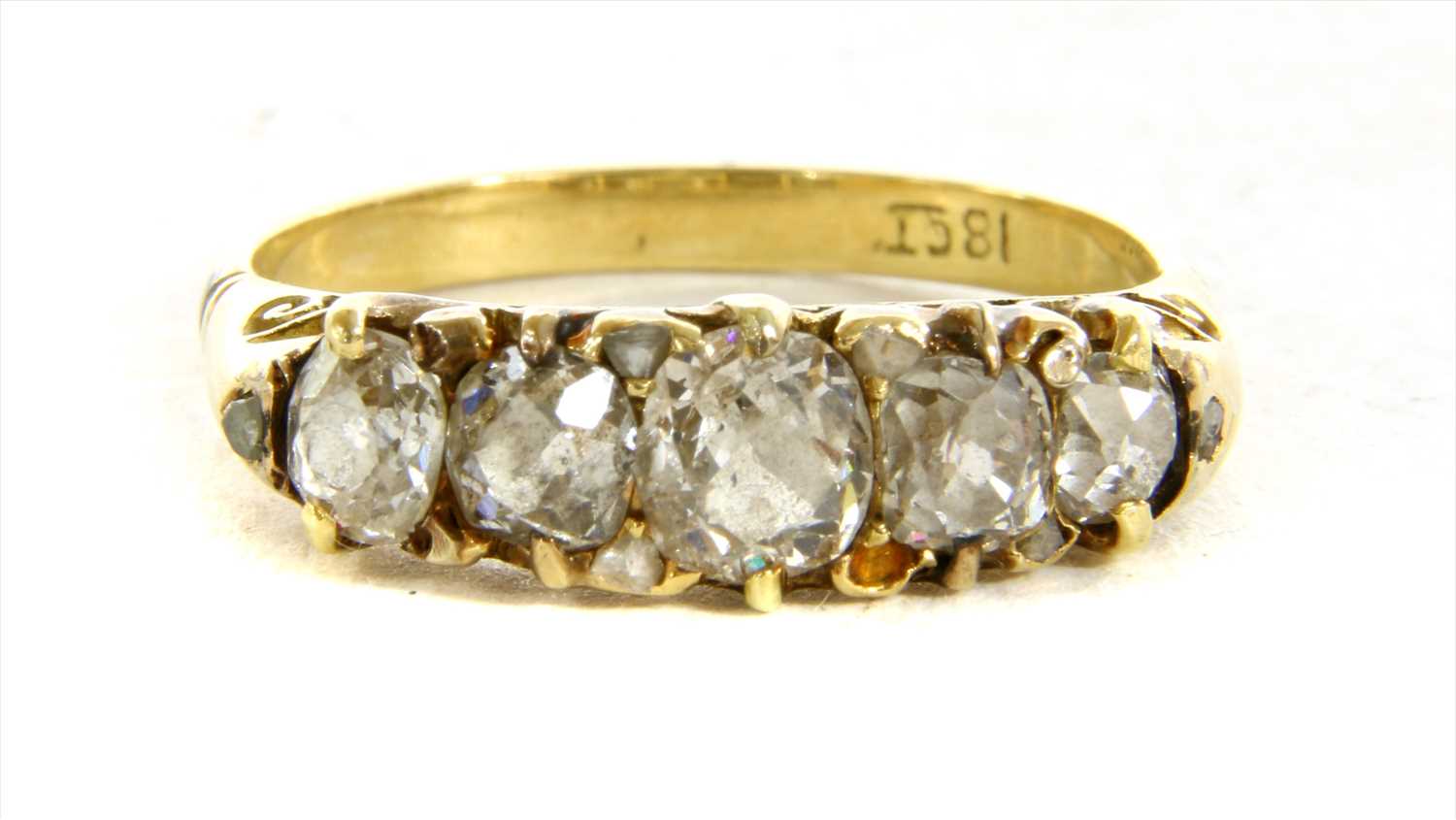 A Victorian five stone diamond carved head ring,