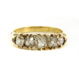 A Victorian five stone diamond carved head ring,