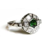 An 18ct white gold tsavorite garnet and diamond cluster ring,