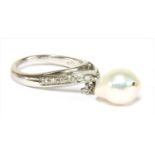 A white gold cultured baroque pearl and diamond ring,
