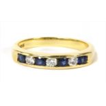 An 18ct gold diamond and sapphire half eternity ring,