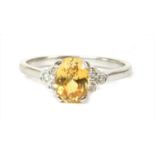 An 18ct gold yellow sapphire and diamond ring,