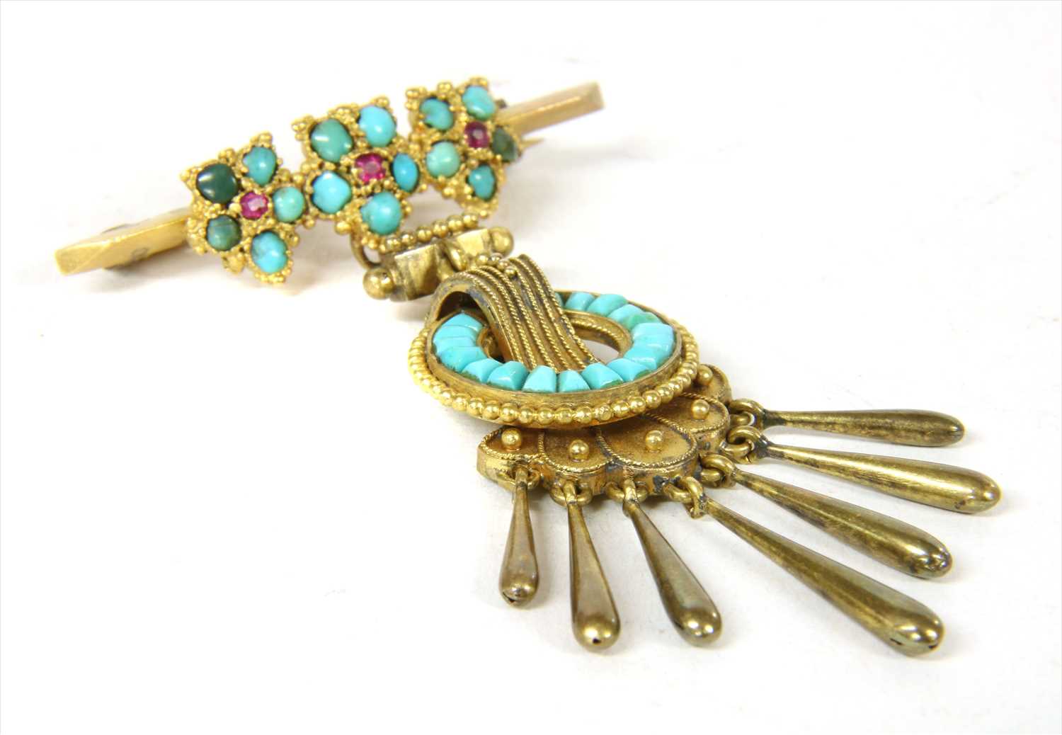 A gold ruby and turquoise brooch,