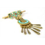 A gold ruby and turquoise brooch,
