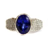 A white gold single stone tanzanite ring