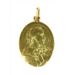 An Art Nouveau gold medallion,