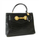 A Gianni Versace black patent leather crocodile embossed handbag
