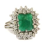 An 18ct gold emerald and diamond rectangular cluster ring, c.1970