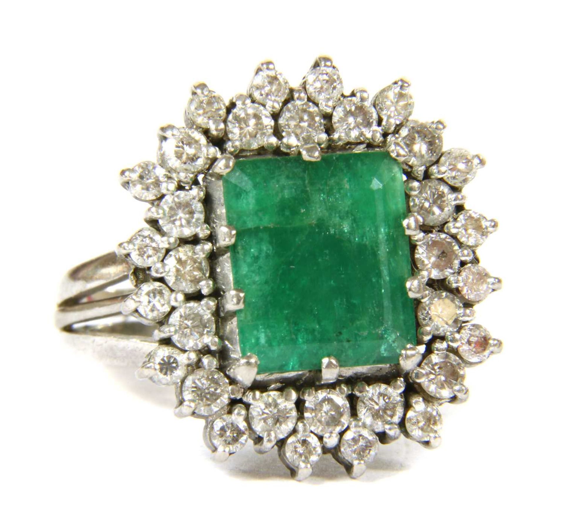 An 18ct gold emerald and diamond rectangular cluster ring, c.1970