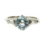 A platinum aquamarine and diamond three stone ring