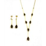 An 18ct gold garnet 'Y' necklace and earrings suite,