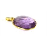 A gold amethyst pendant,