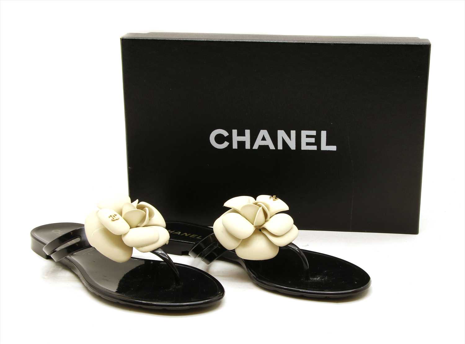 A pair of Chanel camellia flower jelly thong sandals,