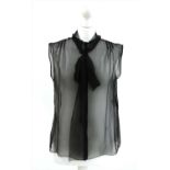 A Alberta Ferretti black silk sheer top and a pair of Ralph Lauren metallic grey shorts