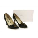 A pair of Jimmy Choo black leather court shoes